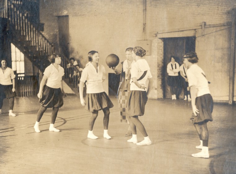 caption - Tip off at High School Basketball Game, 1920's